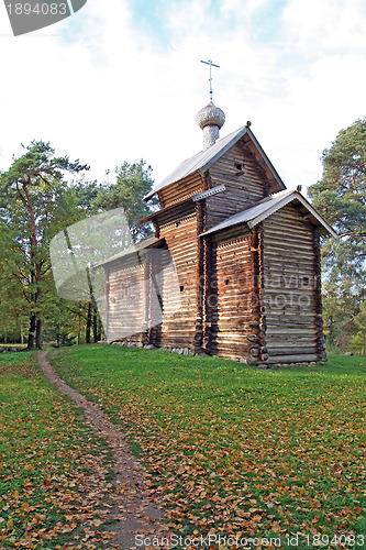 Image of wooden chapel in autumn wood