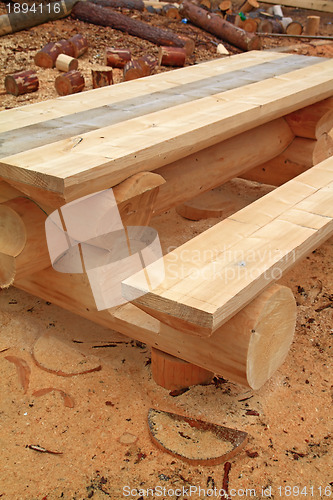 Image of wooden bench amongst yellow sawdust