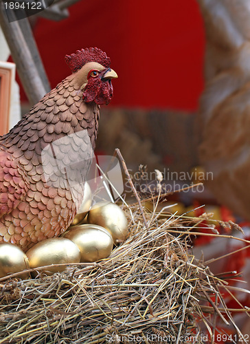 Image of hen in jack on golden egg