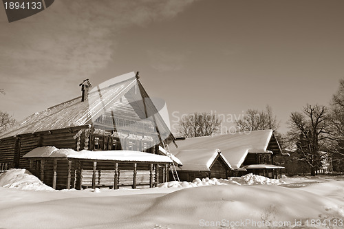 Image of old wooden house in village , sepia