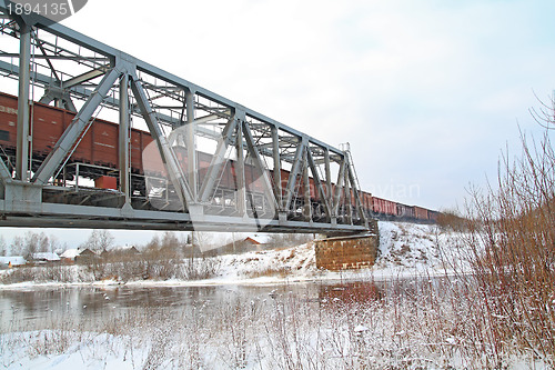 Image of freight train on railway bridge 