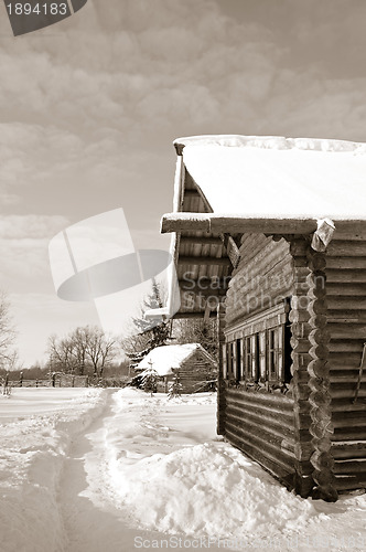 Image of old wooden house in village , sepia