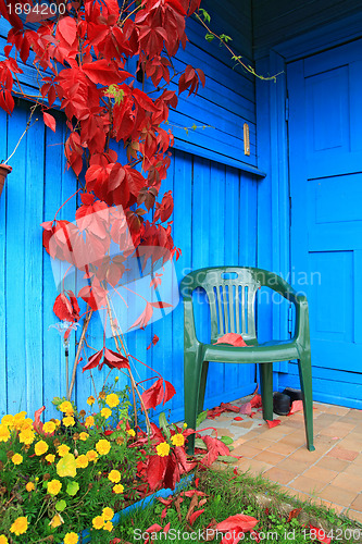 Image of red sheet on wall of the rural building