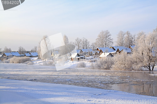 Image of winter ice on river near villages