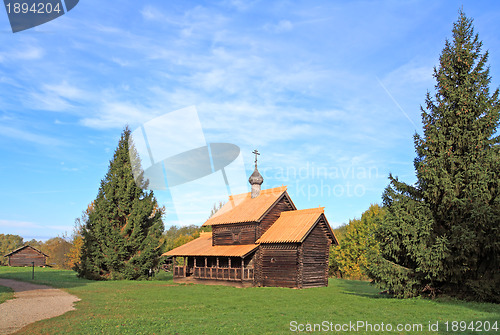 Image of aging wooden chapel in village