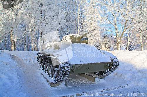 Image of old tank fallen asleep by snow