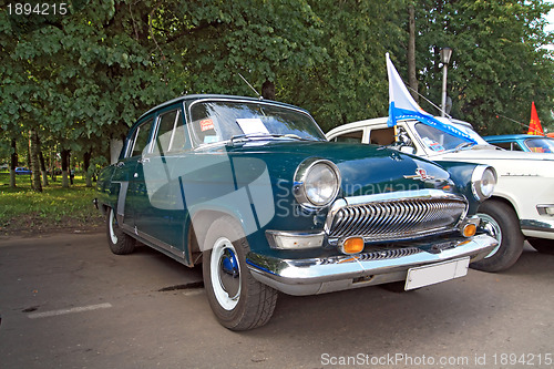 Image of old car on town street