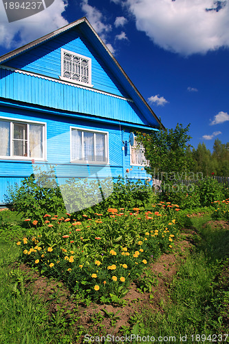 Image of summer flowerses near rural building