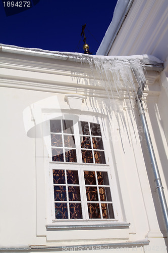 Image of icicles on roof of the white building