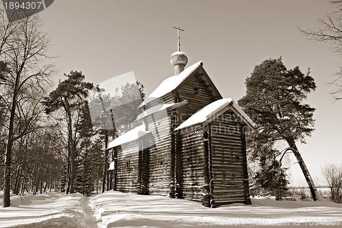 Image of wooden chapel in pine wood, sepia