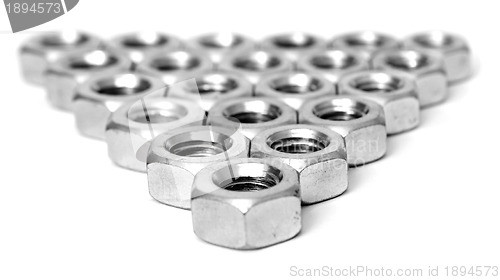 Image of Layer of metal nuts