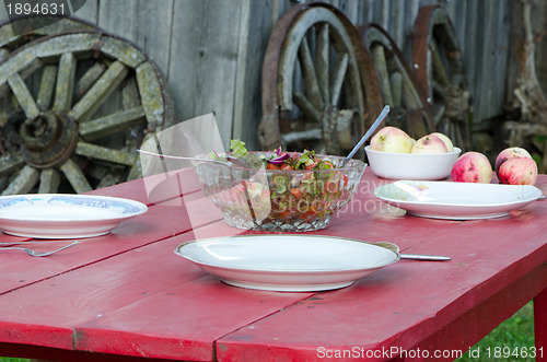 Image of Salad glass dish and apples wooden homestead table 