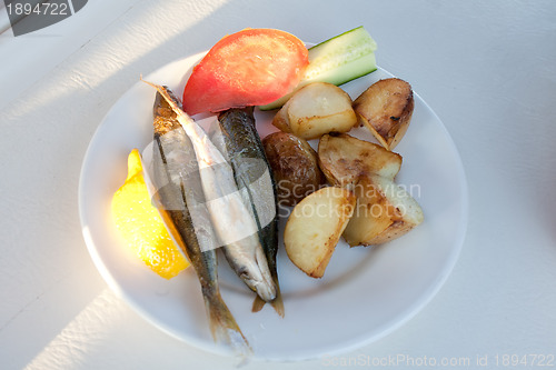 Image of fried fish and potatoes 