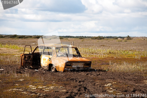 Image of abandoned rusty car
