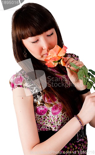 Image of Pretty woman with flower