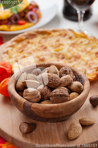 Image of Nuts in bowl with apple pie