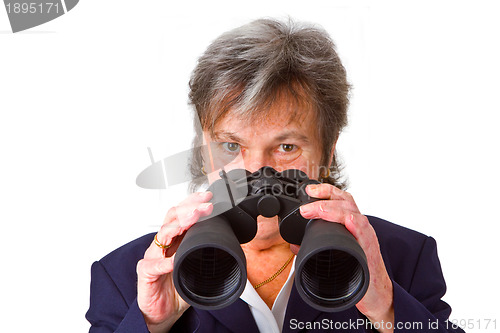 Image of Female senior business woman with binoculars