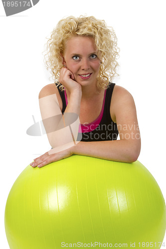 Image of Beautiful young woman with gym ball