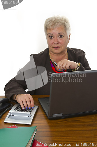 Image of Female senior working in office