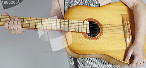 Image of Playing the guitar