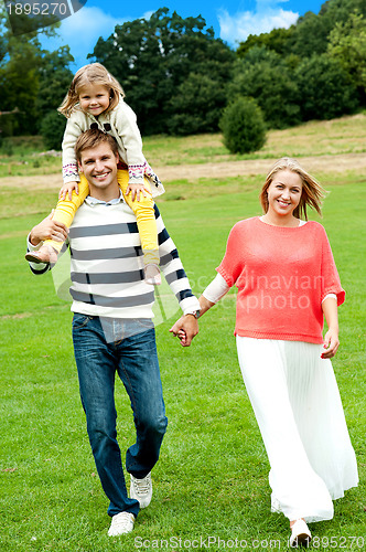 Image of Portrait of family of three. Outdoor