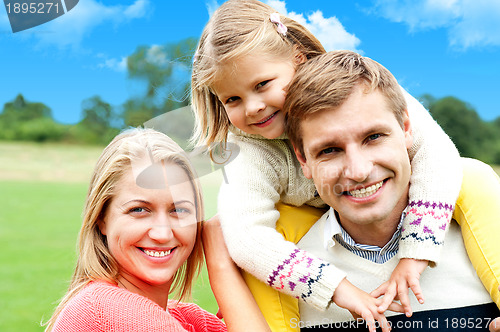 Image of Beautiful happy caucasian family of three