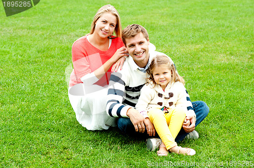 Image of Portrait of happy young family with daughter