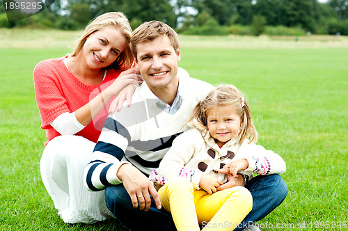 Image of Outdoor happy caucasian family relaxing