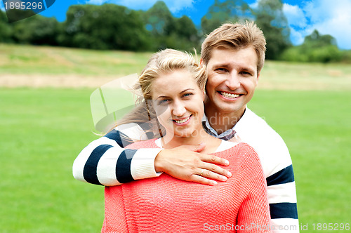 Image of Husband hugging his wife from back