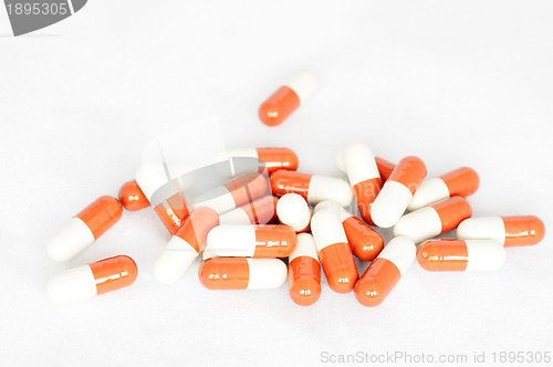 Image of Group of red-and-white capsules