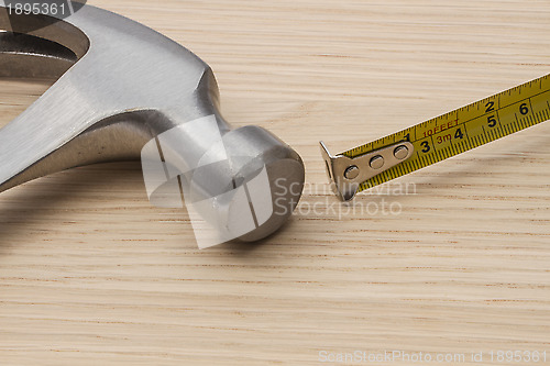 Image of Old hammer and tape measure 