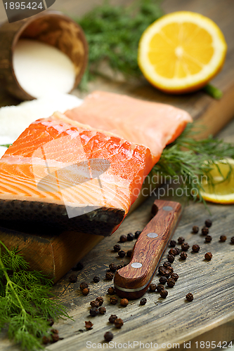 Image of Fresh salmon with black pepper and dill.