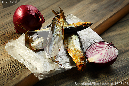 Image of Smoked sprat and red onion.