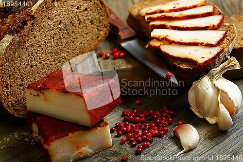 Image of Salt pork with red pepper and rye bread.