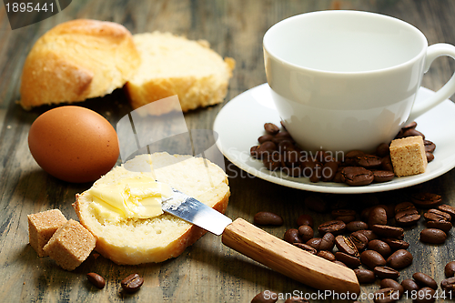 Image of Coffee beans, eggs, bread and butter.