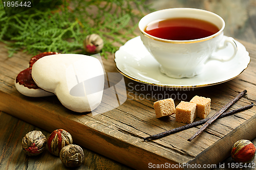 Image of Spiced tea and ginger biscuits.