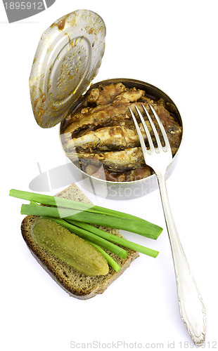 Image of Anchovies in a tin can with rye bread
