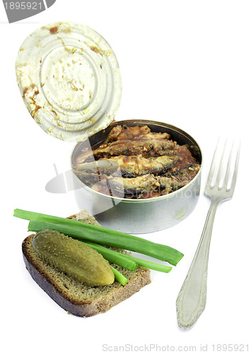 Image of Anchovies in a tin can with rye bread