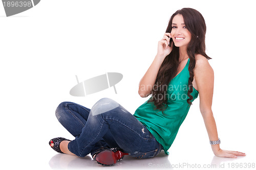 Image of girl sitting and talking on phone