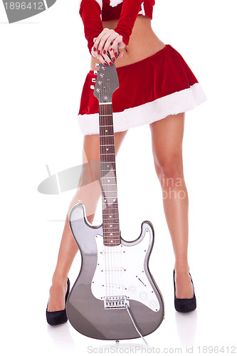 Image of sexy legs of a santa woman with guitar