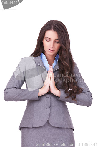 Image of business woman praying