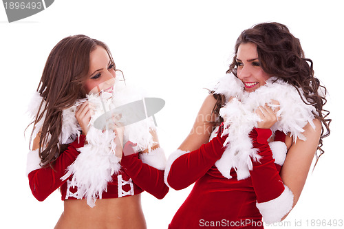 Image of sexy santa women looking at each other