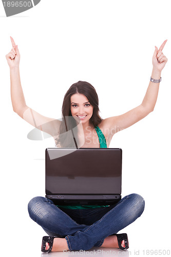 Image of  woman with laptop celebrating