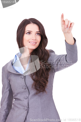 Image of business woman pushing imaginary screen