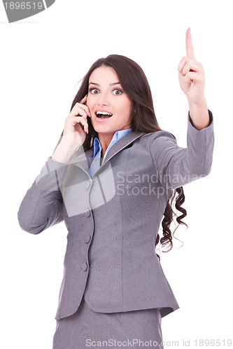 Image of business woman on the phone winning