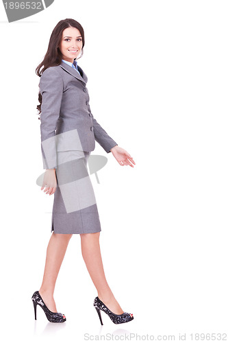 Image of side view of a business woman walking