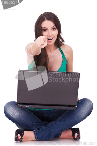 Image of woman with laptop pointing