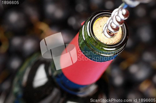 Image of Opening a bottle of red wine