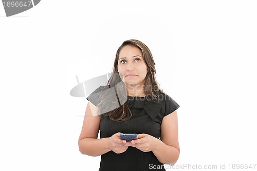 Image of Close-up of a brunette texting against white background 
