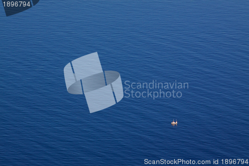 Image of Seascape with tiny fishing boat